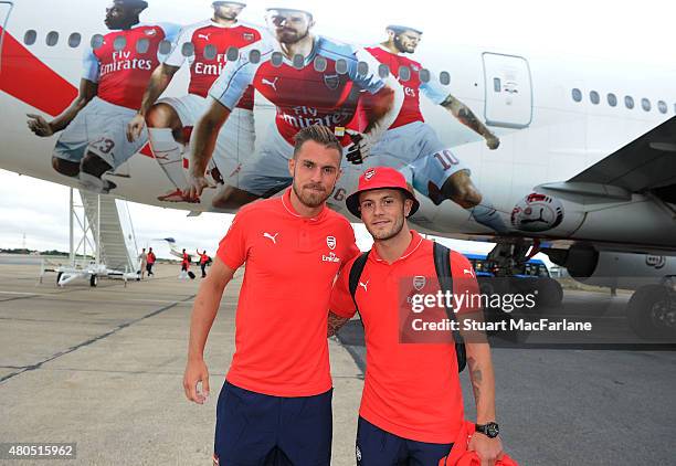 Arsenal's Aaron Ramsey and Jack Wilshere in front of the Emirates plane as they travel to Singapore for the Barclays Asia Trophy at Stansted Airport...