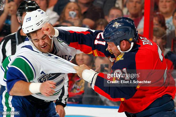 Tom Sestito of the Vancouver Canucks fights with Krys Barch of the Florida Panthers at the BB&T Center on March 16, 2014 in Sunrise, Florida.