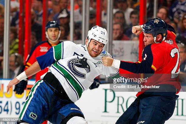 Tom Sestito of the Vancouver Canucks fights with Krys Barch of the Florida Panthers at the BB&T Center on March 16, 2014 in Sunrise, Florida.