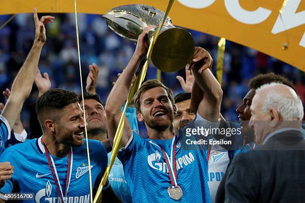 Nicolas Lombaerts of FC Zenit St. Petersburg lifts up the trophy after the Super Cup of Russia 2015 match between FC Zenit St. Petersburg and FC...