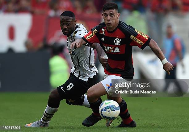 Ayrton of Flamengo struggles for the ball with Vagner Love of Corinthians during a match between Flamengo and Corinthians as part of Brasileirao...