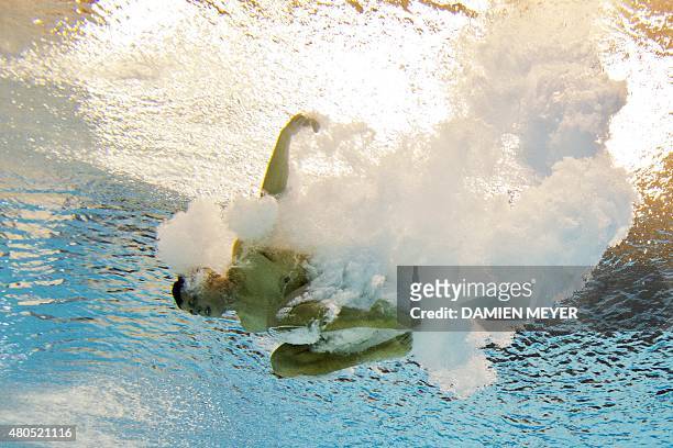 This picture taken with an underwater camera shows Ryan Hawkins of the USA competing in the men's diving 10m platform preliminary event at the Pan...