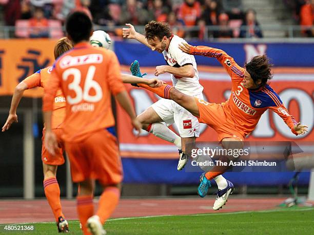 Joshua Kennedy of Nagoya Grampus heads the ball during the J.League match between Albirex Niigata and Nagoya Grampus at Tohoku Denryoku Big Swan...