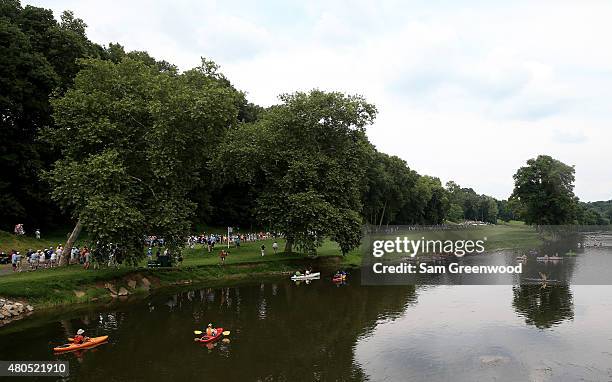 Amy Yang of South Korea tees of on the seventh hole as kayakers watch the action during the final round of the U.S. Women's Open at Lancaster Country...