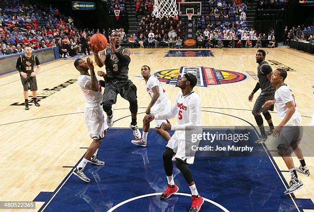 Isaiah Sykes of the UCF Knights drives to the basket for a layup against the Cincinnati Bearcats during the quarterfinal round of the American...