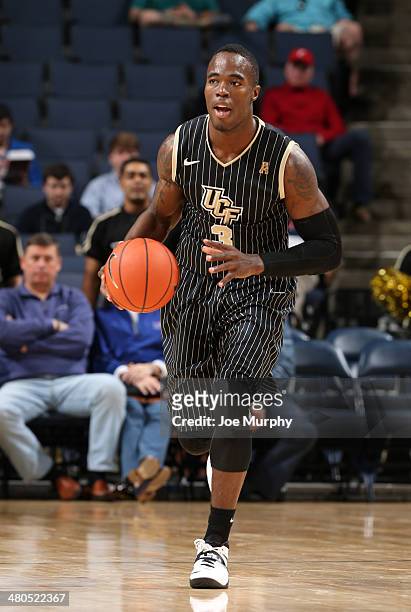 Isaiah Sykes of the UCF Knights dribbles the ball up the court against the Cincinnati Bearcats during the quarterfinal round of the American Athletic...