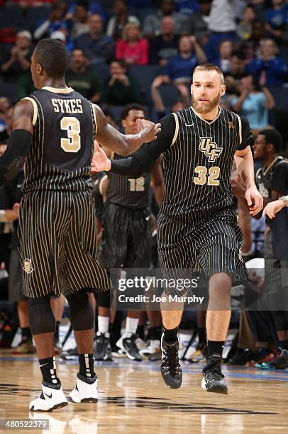 Kasey Wilson and Isaiah Sykes of the UCF Knights celebrate against the Cincinnati Bearcats during the quarterfinal round of the American Athletic...