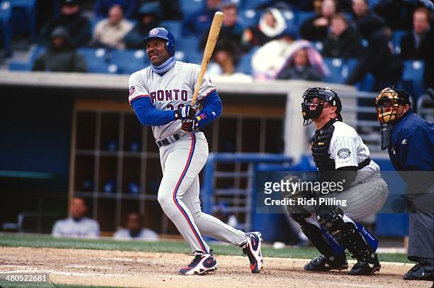 Joe Carter of the Toronto Blue Jays bats during the game against the Chicago White Sox at Comiskey Park on Thursday, April 10, 1997 in Chicago,...