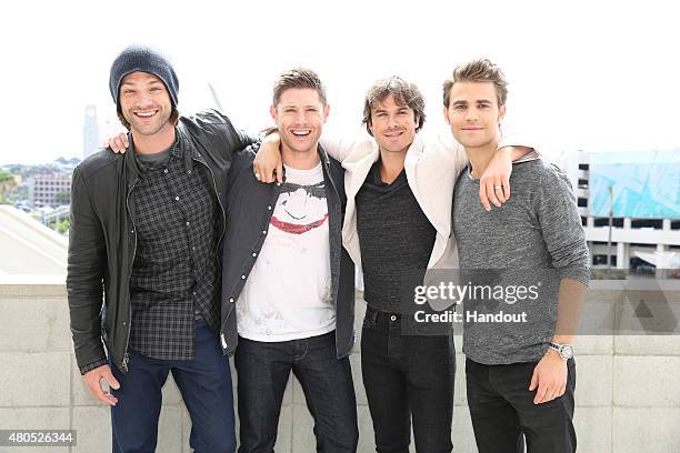 In this handout photo provided by Warner Bros. Entertainment, Inc, SUPERNATURAL stars Jared Padalecki and Jensen Ackles with THE VAMPIRE DIARIES...