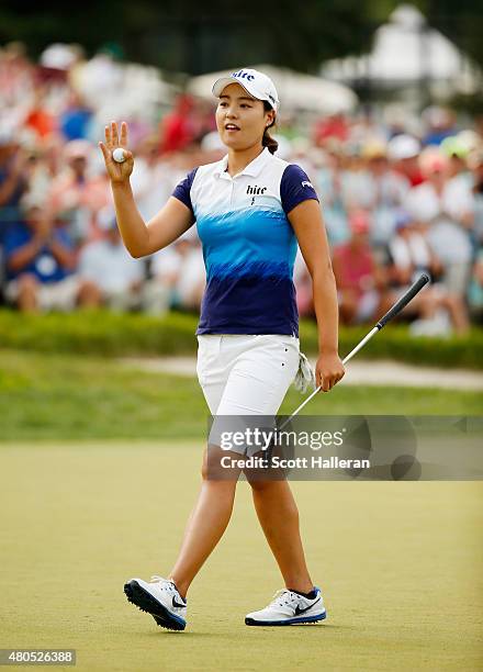 In Gee Chun of South Korea waves to the gallery as she walks off the 18th green during the final round of the U.S. Women's Open at Lancaster Country...