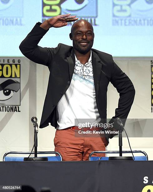Actor Jimmy Jean-Louis waves to audience onstage at the "Heroes Reborn" exclusive extended trailer and panel during Comic-Con International 2015 at...