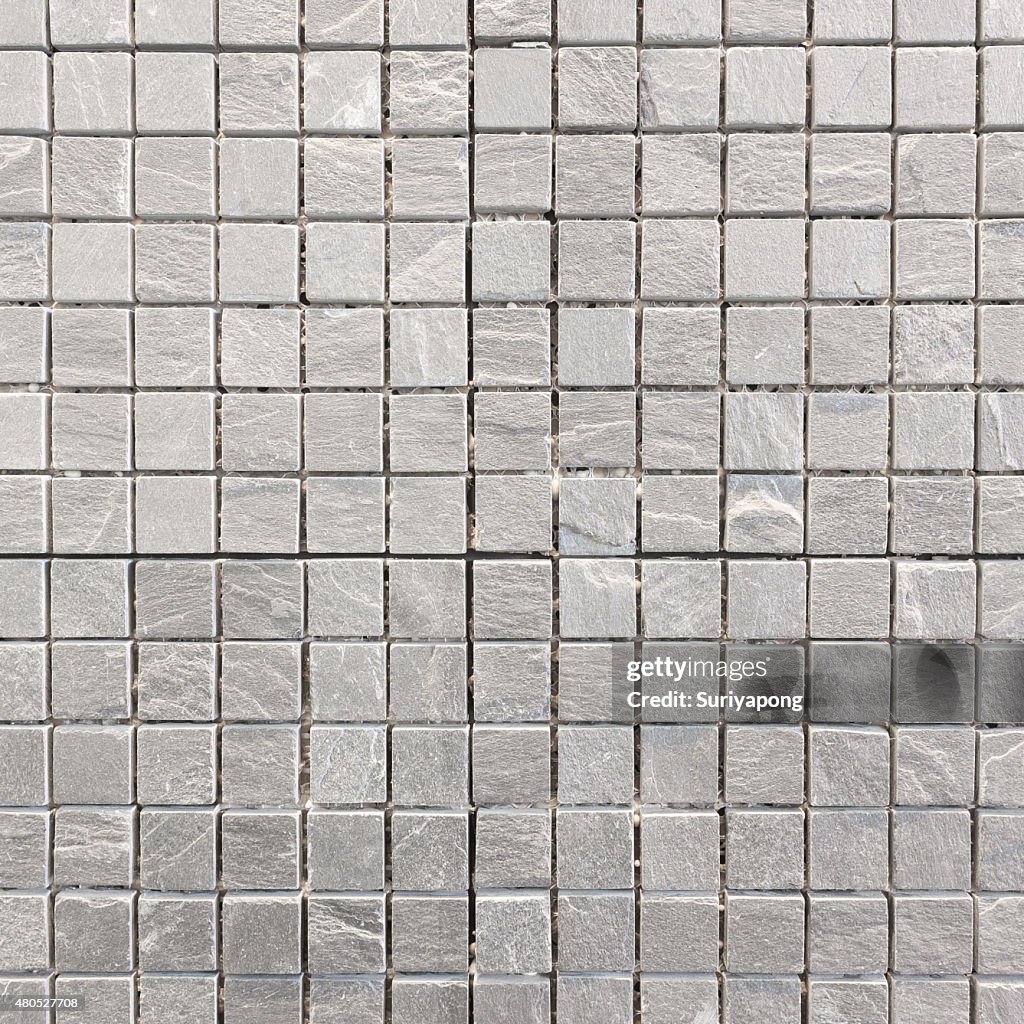 Gray tile on the wall texture and backgroud.