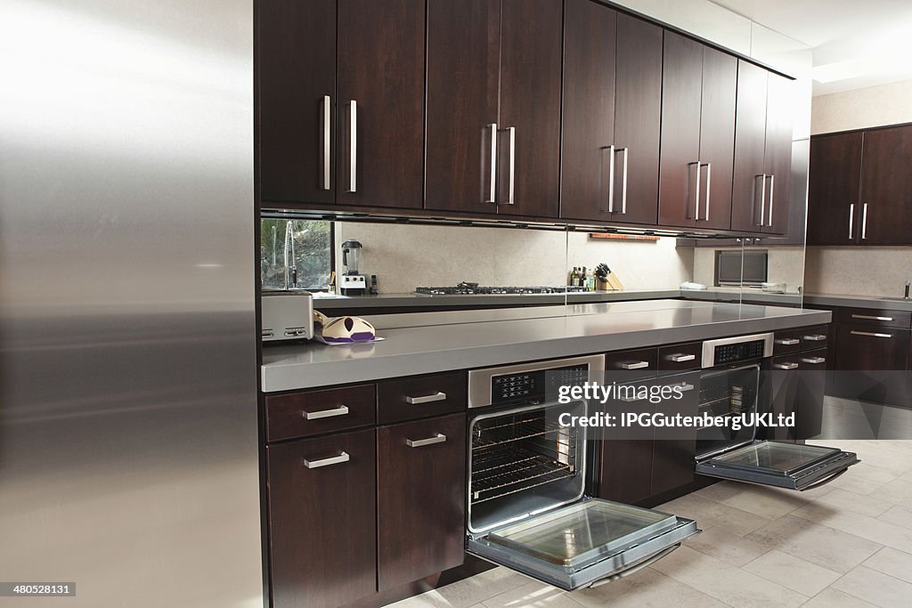 Commercial Kitchen With Open Oven And Cabinets