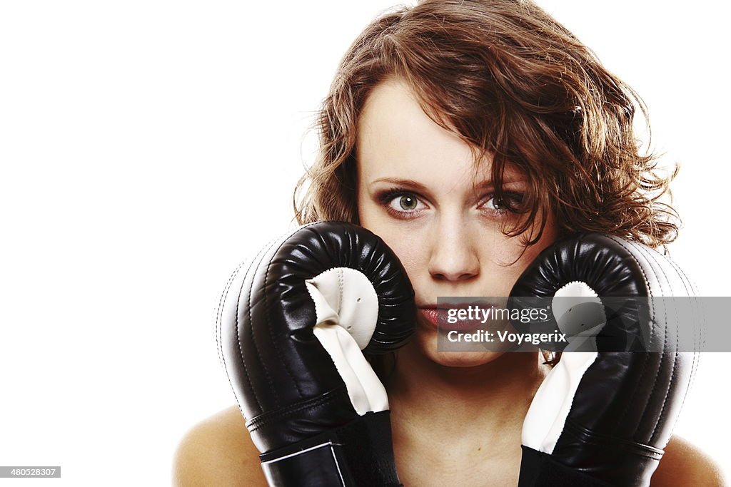 Fit woman boxing - isolated over white