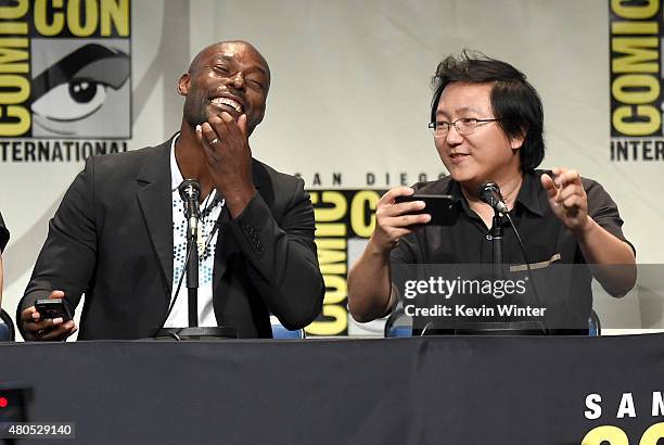 Actors Jimmy Jean-Louis and Masi Oka speak onstage at the "Heroes Reborn" exclusive extended trailer and panel during Comic-Con International 2015 at...