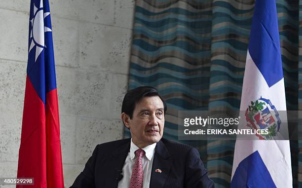 Taiwan' President Ma Ying-jeou listens to questions during an interview with the international press in Santo Domingo, on July 12, 2015. During his...