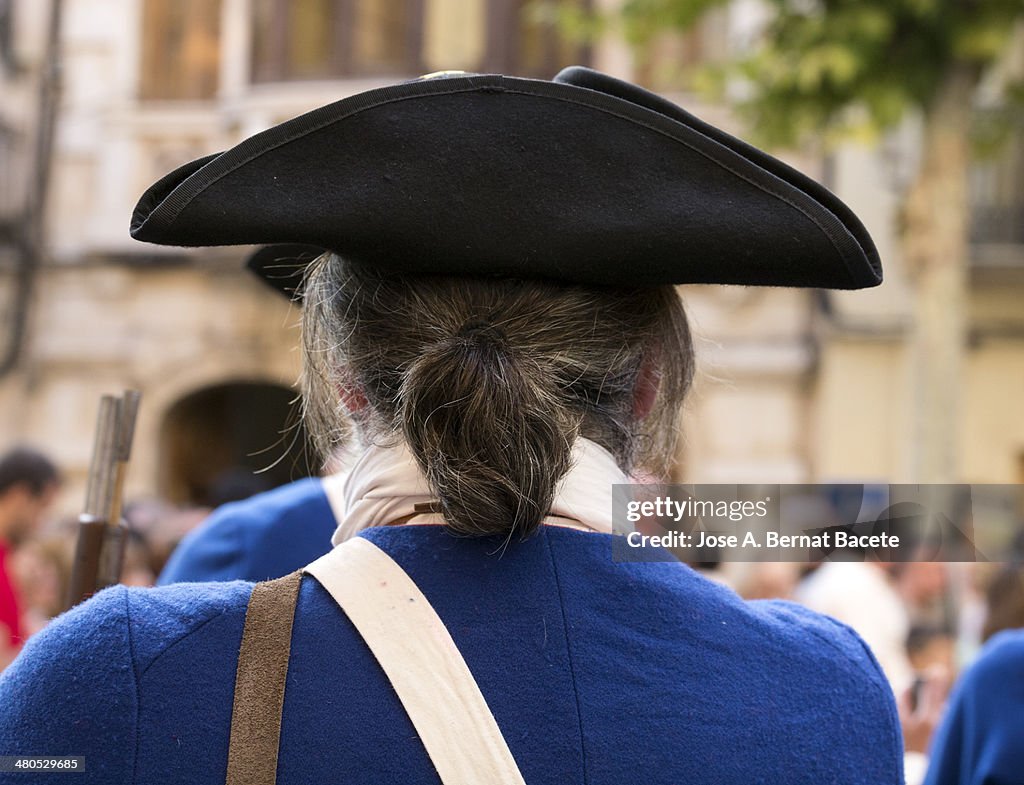 Hat of a soldier of epoch with cue and jacket