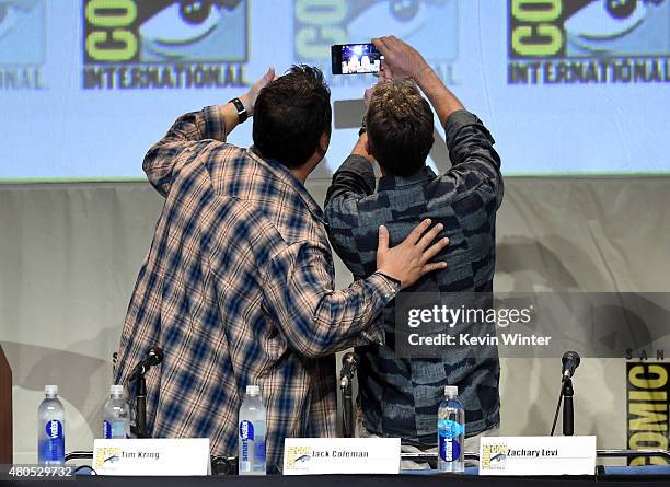 Actor Greg Grunberg and writer/producer Tim Kring take a selfie onstage at the "Heroes Reborn" exclusive extended trailer and panel during Comic-Con...