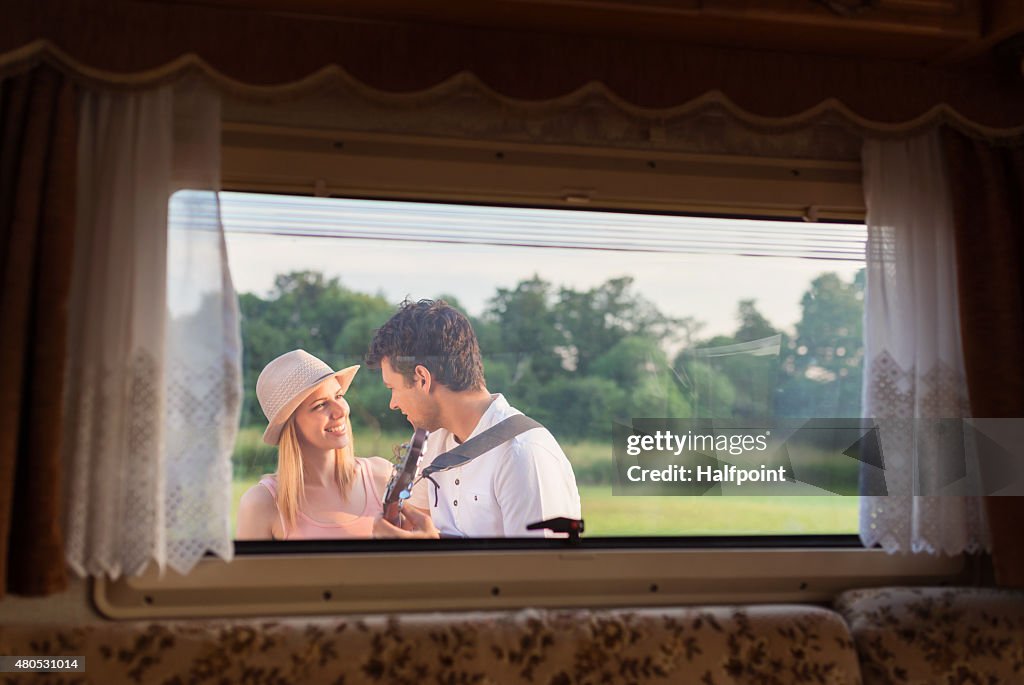 Young couple with a camper van