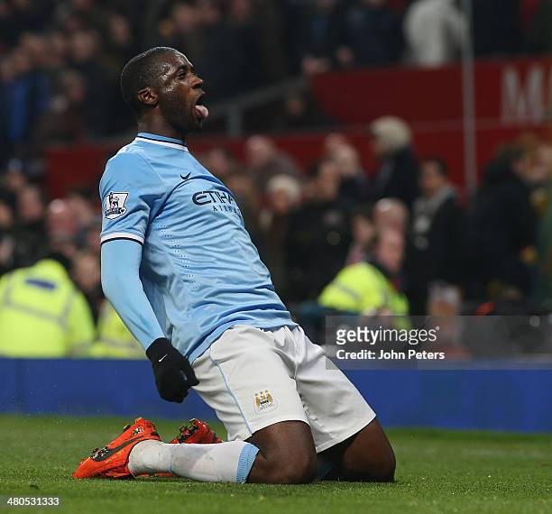 Yaya Toure of Manchester City celebrates scoring their third goal during the Barclays Premier League match between Manchester United and Manchester...