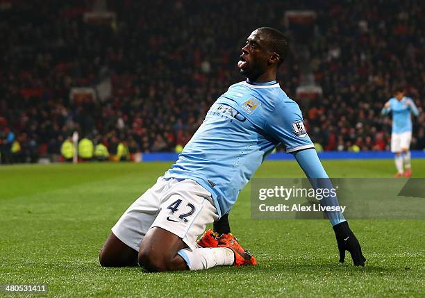 Yaya Toure of Manchester City celebrates scoring the third goal during the Barclays Premier League match between Manchester United and Manchester...