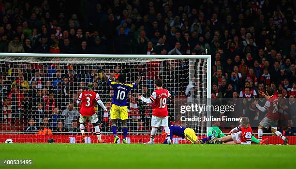 Wilfried Bony of Swansea City celebrates as Mathieu Flamini of Arsenal scores an own goal to make it 2-2 during the Barclays Premier League match...