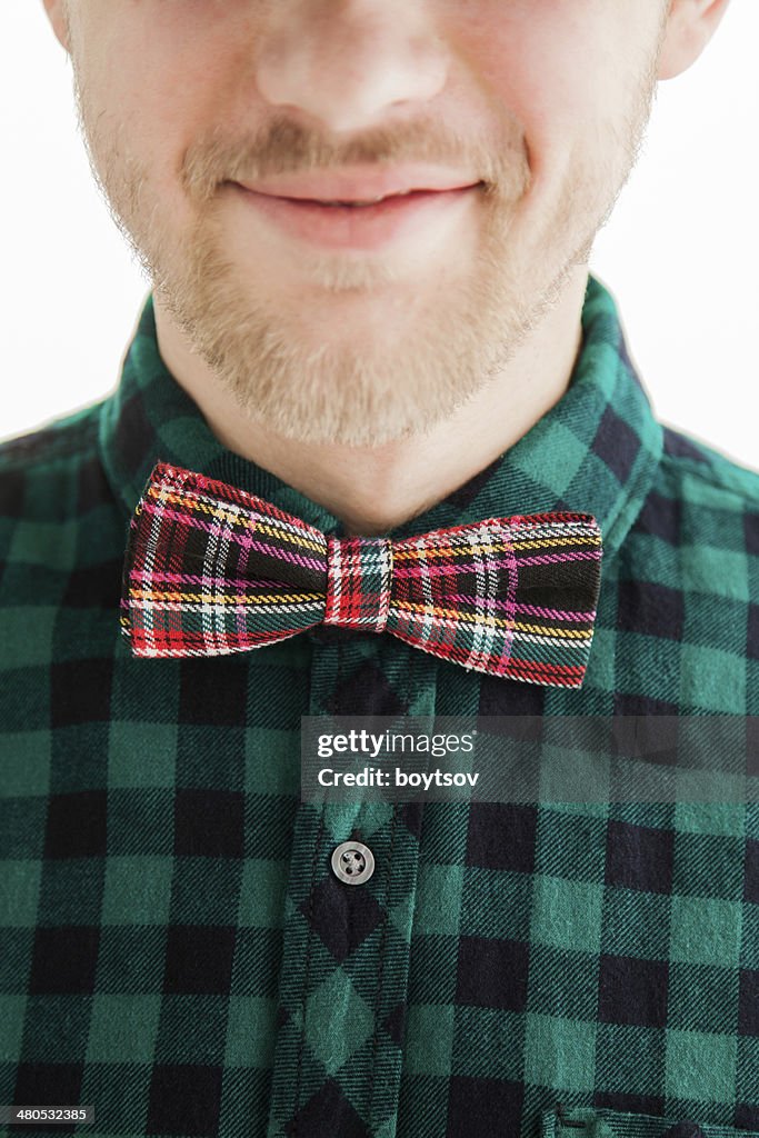 Young smiling man in bowtie