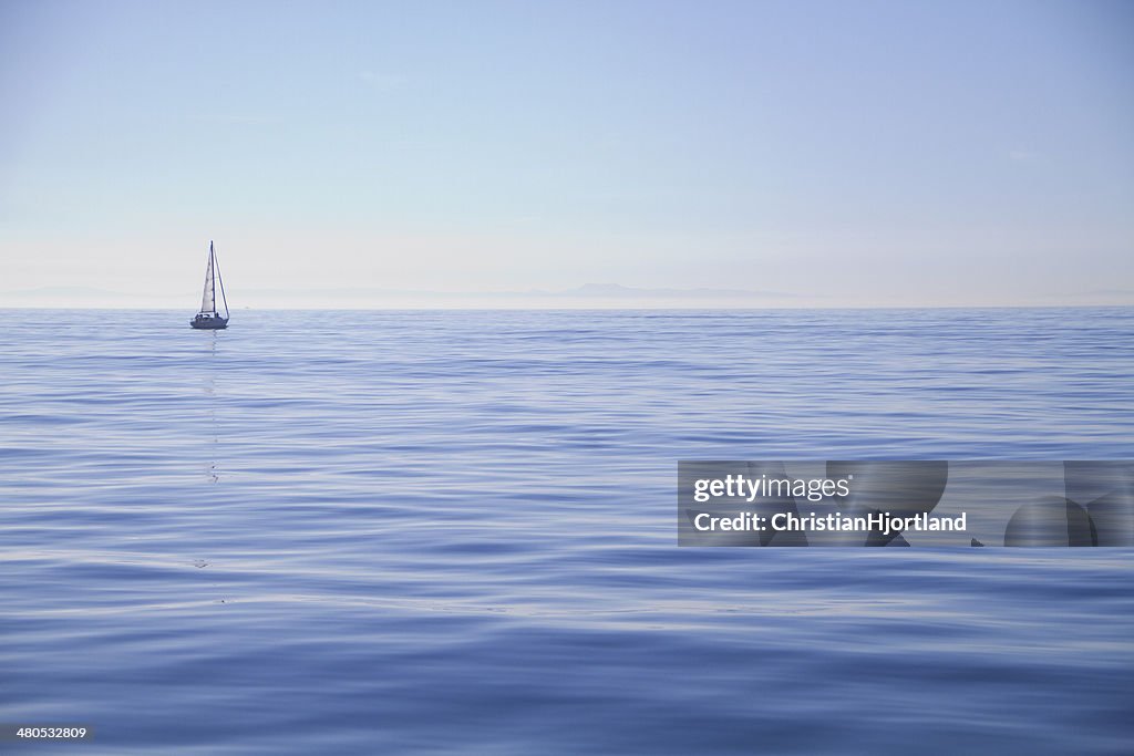 Sailboat alone on the ocean