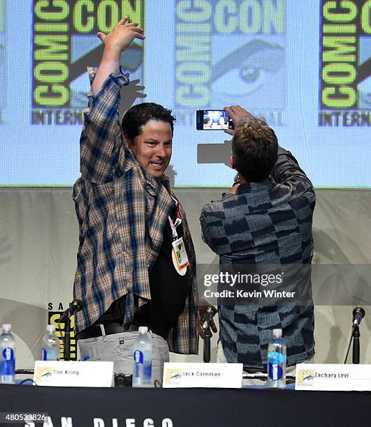 Actor Greg Grunberg and writer/producer Tim Kring take a selfie onstage at the "Heroes Reborn" exclusive extended trailer and panel during Comic-Con...