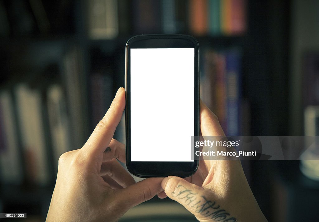Hands holding blank smartphone