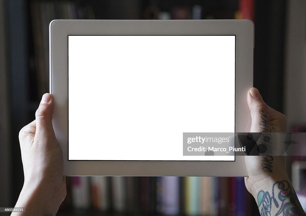 Hands holding blank tablet