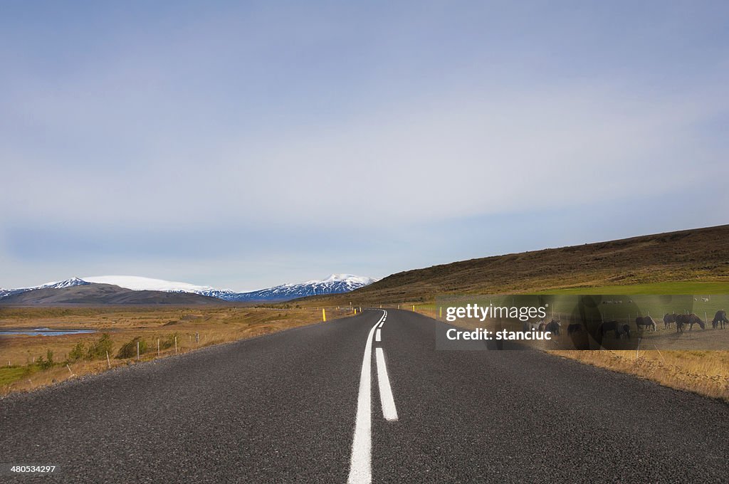 Beautiful mountain road in Iceland, with glaciers on the horizon