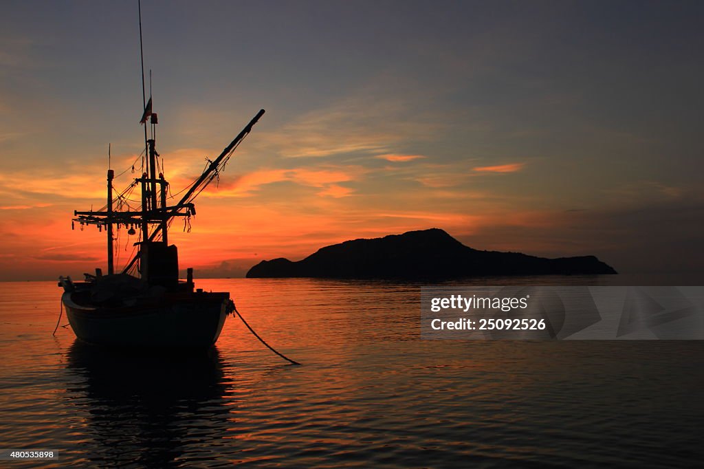Fishing boat and sunrise