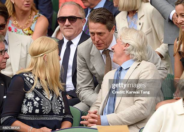 Patricia Ostfeldt, Hugh Grant and Bjorn Borg attend day 13 of the Wimbledon Tennis Championships at Wimbledon on July 12, 2015 in London, England.