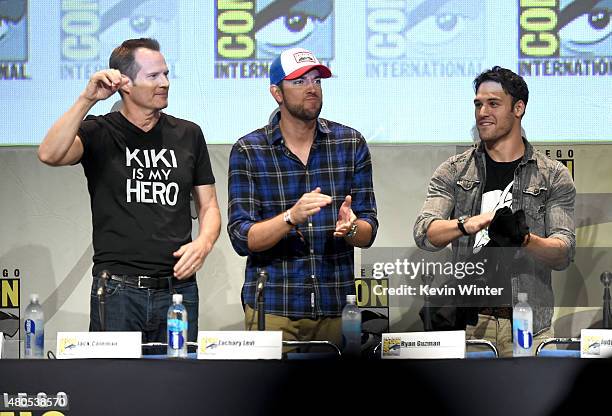 Actors Jack Coleman, Zachary Levi and Ryan Guzman applaud onstage at the "Heroes Reborn" exclusive extended trailer and panel during Comic-Con...