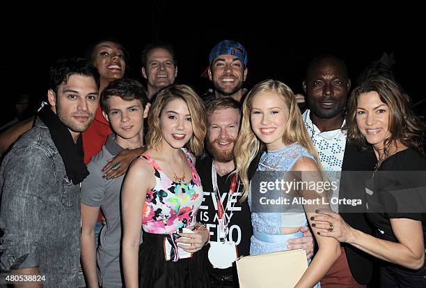 Actor Zachary Levi and cast and crew pose backstage at the "Heroes Reborn" exclusive extended trailer and panel during Comic-Con International 2015...