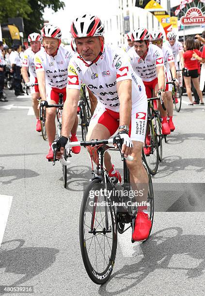 Bernard Thevenet participates at a charity event benefitting 'Mecenat Chirurgie Cardiaque', riding the same stage as the professionals, an hour...