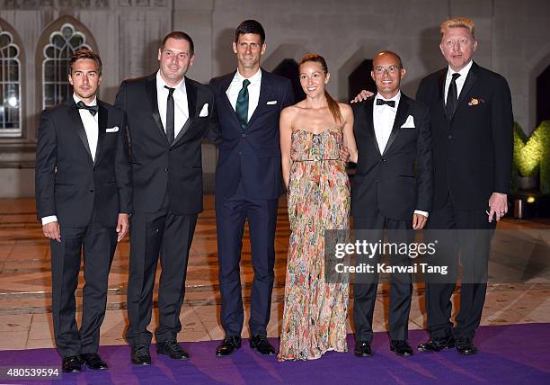 Novak Djokovic and wife Jelena with his entourage including Boris Becker attend the Wimbledon Champions Dinner at The Guildhall on July 12, 2015 in...