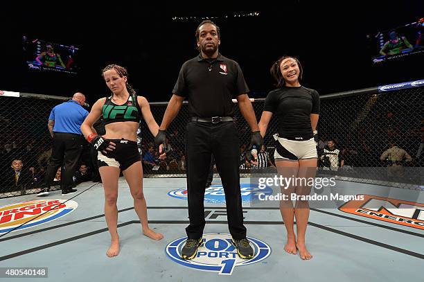 Angela Magana and Michelle Waterson wait for the final decision in their women's strawweight bout during the Ultimate Fighter Finale inside MGM Grand...