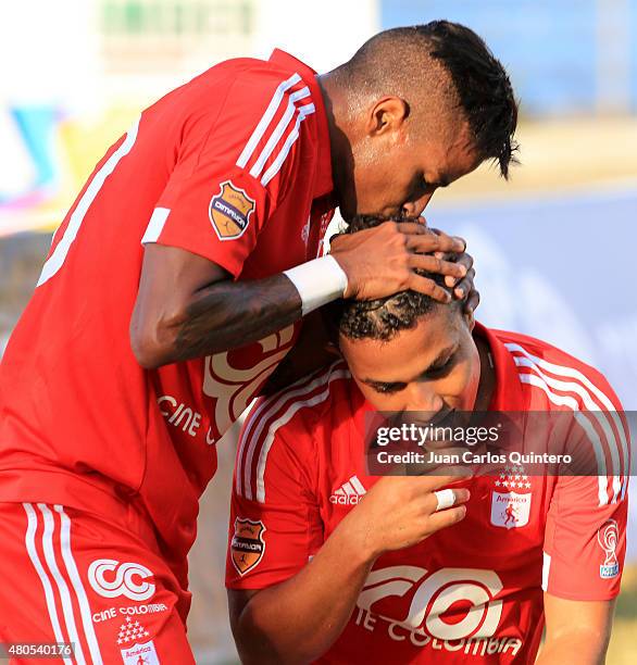 Feiver Mercado of America de Cali celebrates with his teammate after scoring the third goal of his team during a match between America de Cali and...