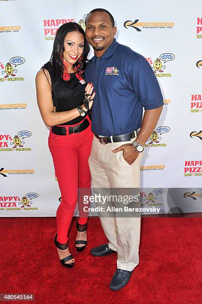 Former NFL player Eric King and recording artist SoulFia King host grand opening of Happy's Pizza on July 12, 2015 in Los Angeles, California.