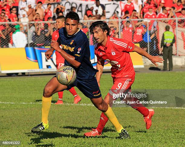 Aldayr Hernandez of Bogota FC and Ernesto Farias of America de cali fight for the ball during a match between America de Cali and Bogota FC as part...