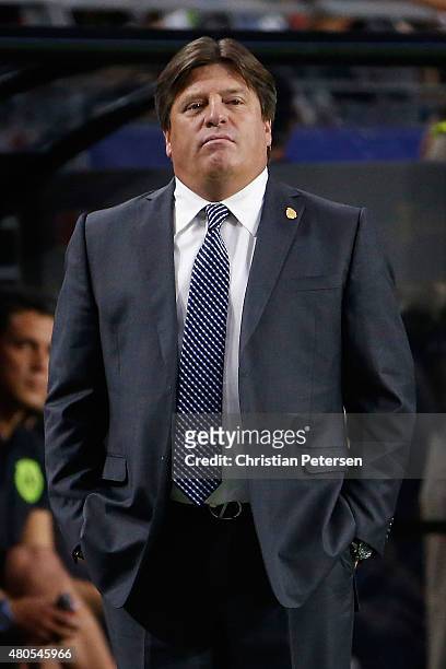 Head coach Miguel Herrera of Mexico reacts on the sidelines during the 2015 CONCACAF Gold Cup group C match against Guatemala at University of...
