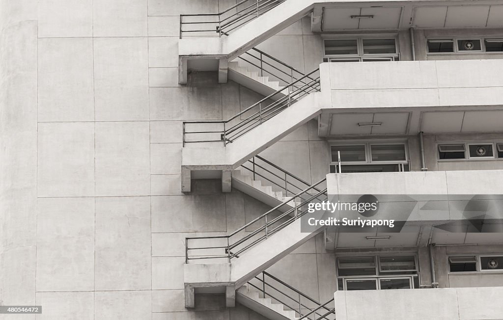 Concrete fire escape outside apartment building for emergency