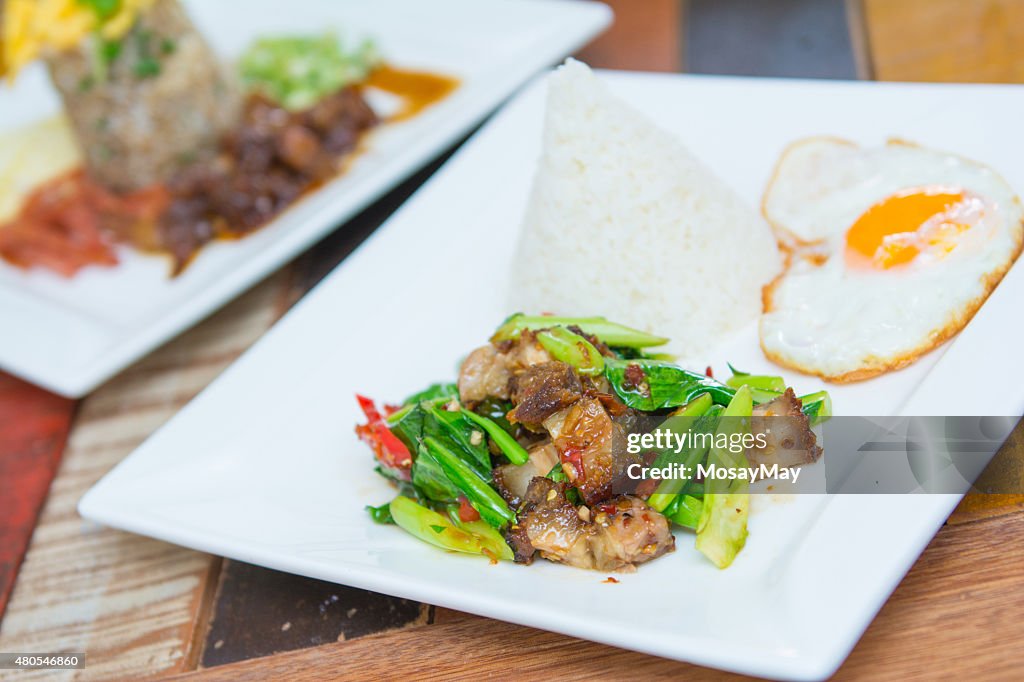 Kale with crispy pork and rice