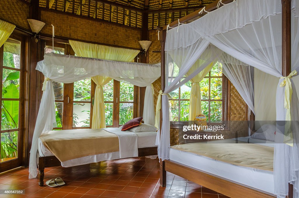 Bungalow and bed in a resort in Bali Indonesia