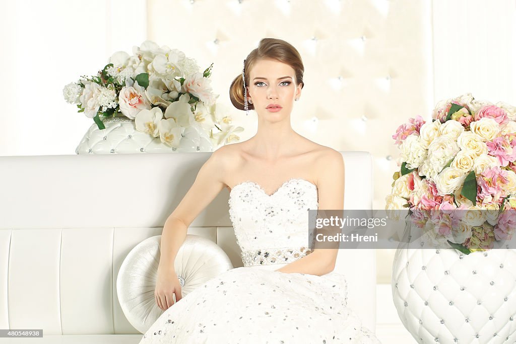 Gorgeous bride in a white room
