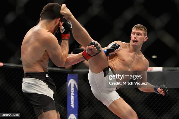 Stephen Thompson kicks Jake Ellenberger in their welterweight bout during the Ultimate Fighter Finale inside MGM Grand Garden Arena on July 12, 2015...