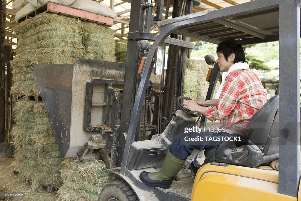 Man operating forklift