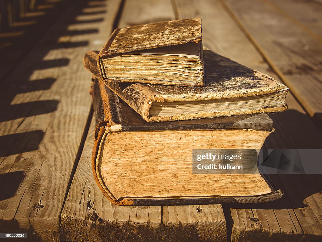 Old books on a wooden floor terrace